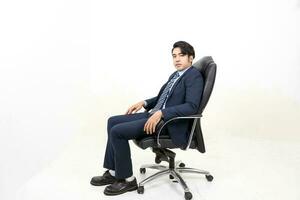 South east Asian Malay Man facial expression sit on chair confident photo