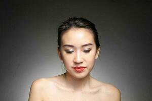 Young beautiful Asian woman facial expression photo