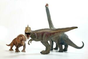 Tyrannosaurus Triceratops Brachiosaurus Dinosaur Toy figurine on white background photo