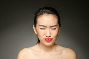 Young beautiful Asian woman facial expression photo