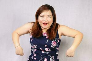 Young attractive southeast Asian woman posing facial expression happy joyful funny photo