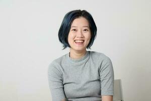 Young attractive Asian chinese malay woman pose face body expression mode emotion on white background laugh smile happy photo