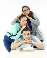 Yong south east Asian middle eastern Caucasian youth man woman in casual dress sit stand at table book stack head on head happy smile look at camera on white background photo