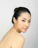 Young beautiful Southeast Asian woman beauty fashion makeup light grey white background photo