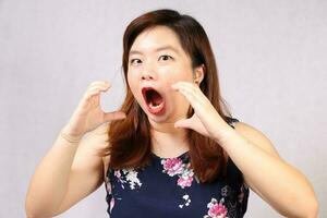 Young attractive southeast Asian woman posing facial expression eat hungry photo