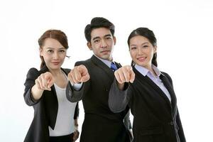 Southeast Asian young office business man woman wearing suit point finger at camera on white studio background photo