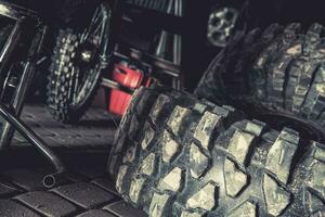 Off Road Vehicle Tires Laying in a Garage photo