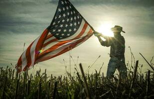 Man Shows Love of Country by Waving American Flag photo