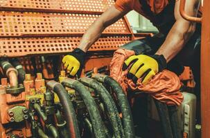 Heavy Machinery Mechanic Performing Pneumatic System Maintenance photo