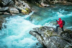 Hiker and the Glacial River photo