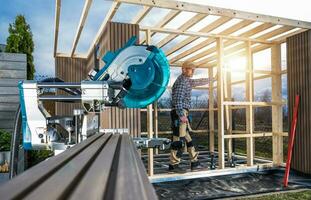 Caucasian Man Building Modern Garden Shed photo