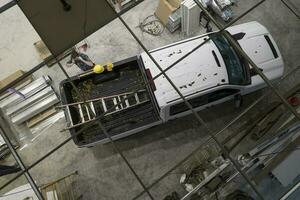 Contractor Worker and His Pickup Truck on a Site photo