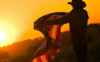 Flag of the United Stands in the Hands of a Cowboy photo