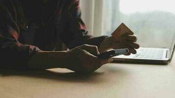 Women holding credit card and using smartphones at home.Online shopping, internet banking, store online, payment, spending money, e-commerce payment at the store, credit card, concept video