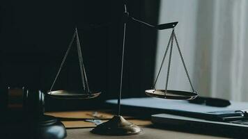 Justice and law concept.Male judge in a courtroom with the gavel, working with, computer and docking keyboard, eyeglasses, on table in morning light video