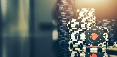 Few Stacks Of Poker Chips On Casino Glass Table. photo