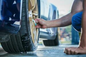 Cleaning Exotic Car Golden Alloy Wheels photo