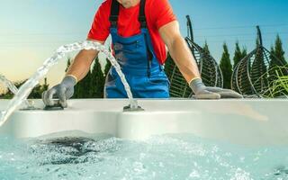 Spa Technician Performing Hot Tub Checks photo