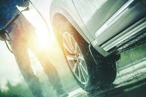 Men Washing Dirty Car photo