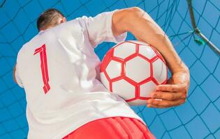 Red and White Soccer Player photo