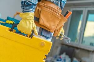 Toolbox in Hand of Contractor photo