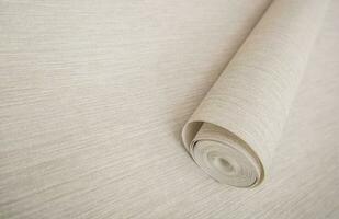 Roll of Modern Vinyl Wallpaper on a Floor photo