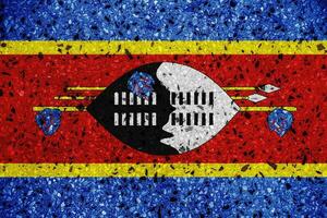 Flag of Kingdom of Eswatini on a textured background. Concept collage. photo