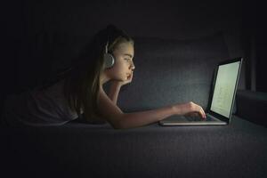 Girl and Her Lazy Time in Front of Laptop Computer photo
