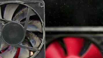 stopped dusty 90 mm pc fan close-up with flying dust particles video