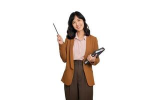 Happy young asian business woman holding notepad and pointing pencil up isolated on white background photo