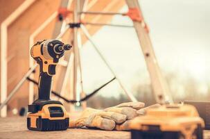 Construction Site Power Tools and Safety Gloves photo