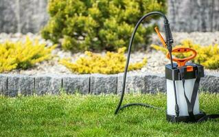 Garden Use Atomizing Backpack Sprayer on a Lawn photo