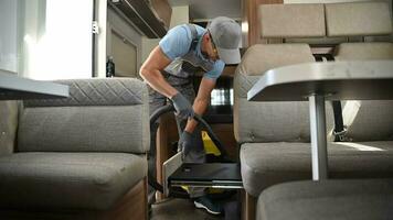 RV Rental Worker Vacuuming a Camper Van video