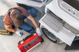 Washing Machine Fixing by Caucasian Professional Technician photo
