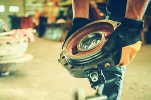 Heavy Equipment Mechanic with a Spare Part in His Hands photo