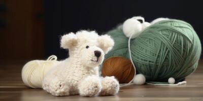 Stuffed animal sits on a table with a yarn photo