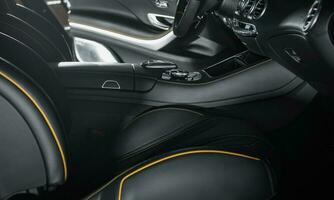 Luxurious Car Dark Leather Front Seats Interior photo