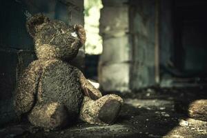 Domestic Violence Theme with Dirty Teddy Bear photo