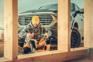 Contractor Preparing His Toolbox in Front of Pickup Truck photo