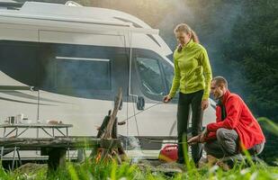 Caucasian Couple RV Park Campfire Fun photo