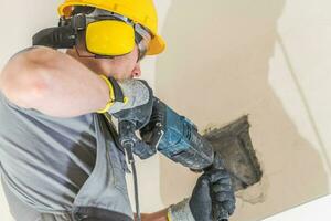 Worker Chiseling Concrete photo