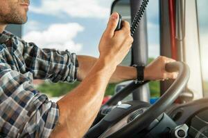 Semi Truck Driver Talking on CB Radio photo