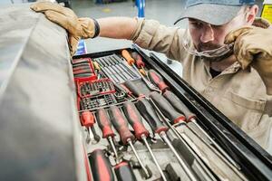 Automotive Auto Service Technician Looking For Right Tools photo