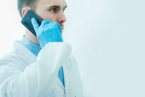 Medical Doctor Talking On Cell Phone. photo