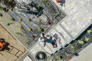 Professional Garden Systems Technician Installing Drip Irrigation photo