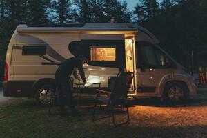Men Browsing Local Map in Front of His RV photo