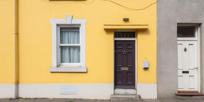 A small white house with yellow door photo