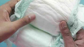 Hand hold a baby diaper close up video