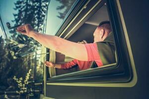 Couple Opening RV Motorhome Side Window photo