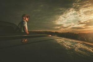 Golden Hour Scenic Drive Stop in Convertible Vehicle photo